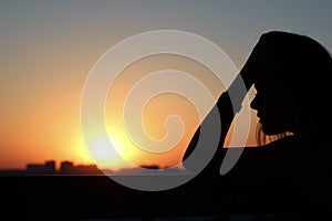 Profile of a beautiful young girl in meditations and reflections photo