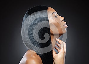 Profile of a black beauty with perfect straight hair