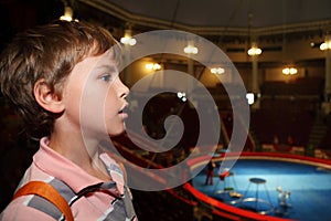 Profile of boy in circus looking at side