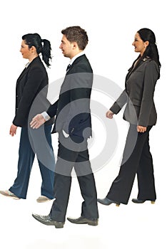 Profile of business people walking