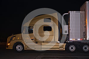 Profile-of-contemporary-elegance-semi-truck-with- night-lights-reflection