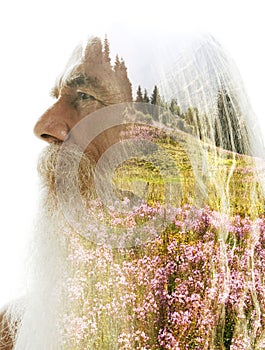 A profile double exposure of an old man merged with a photo of nature