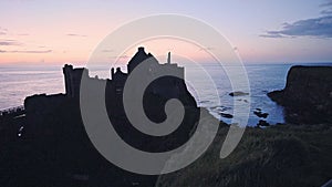 The Profile Of Dunluce Castle And The Coast Of Antrim And Glens During Sunset In Antrim County, Nor