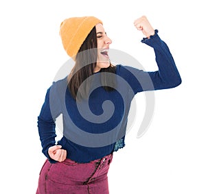 Profile of excited young girl with closed eyes and clenched fists, isolated on white background. Yes concept. Good news. Pretty