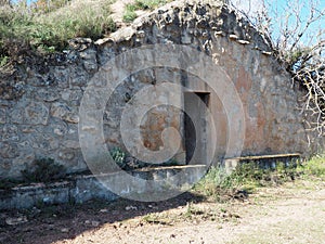 Facade profile of ancient Cueva de Vuelta, Lleida, Spain, Europe photo