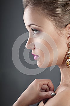 Profile of a girl with earrings