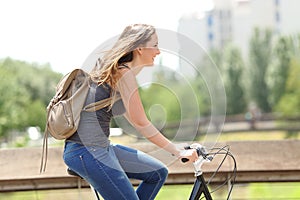 Profile of a happy woman on a bicycle