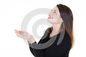 Profile of a happy woman looking up holding something blank