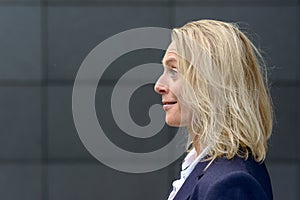 Profile head shot of a surprised blond woman
