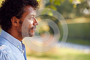 Profile Head And Shoulders Portrait Of Mature Man Outdoors