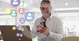 Profile icons and arrows moving upwards against caucasian senior man using smartphone at office