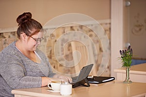 Profile image of overweight caucasian woman working in a cafe
