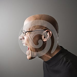 Profile of man screaming. photo