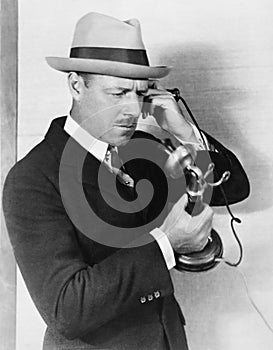 Profile of a man talking on the telephone