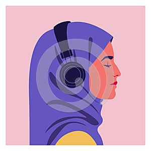 Profile of a muslim woman listens to music on headphones.