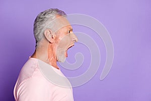 Profile photo of angry retired old man wide open mouth scream look empty space wear pink t-shirt isolated violet color