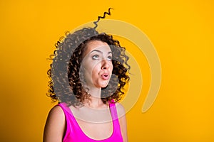 Profile photo of attractive cute youngster wavy hair lady having fun blowing air raise one curl up watch it flight wear