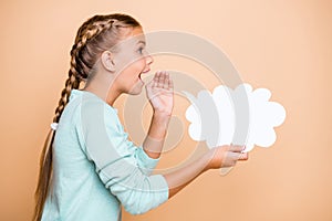 Profile photo of beautiful excited little lady hold empty paper cloud saying whispering dialogue answer hand near mouth