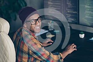 Profile photo of cheerful front end developer sitting chair keyboard typing operating server indoors