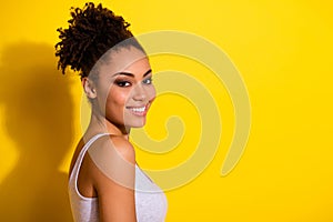 Profile photo of cheerful pretty girl toothy smile empty space advertisement  on yellow color background