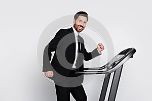 Profile photo of classy positive company executive man run exercise treadmill isolated on grey color background