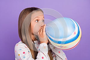 Profile photo of crazy little lady blow inflate air balloon wear crown dotted pajama isolated purple color background