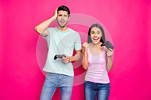 Profile photo of funny guy and lady couple spending weekend together playing video games winner and loser wear casual