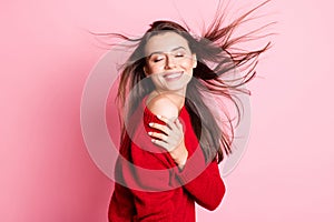 Profile photo of pretty girl closed eyes cuddle shoulders toothy smile wear red pullover isolated pink color background