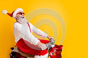 Profile photo of stylish santa white hair grandpa rushing x-mas theme party by retro bike wear trendy sun specs red