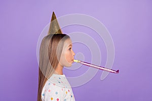 Profile photo of surprised small lady celebrate birthday blow whistle wear dotted pajama isolated purple color