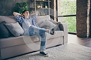 Profile photo of teenager school boy enjoy relaxing sit comfy couch staying home good mood quarantine time hands behind