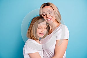 Profile photo of two people beautiful mommy lady little daughter blonds hugging leaning head eyes closed best friends