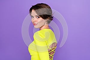 Profile portrait of adorable satisfied glad girl empty space advert wear lime top isolated on purple color background