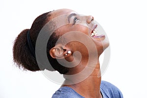 Profile portrait of beautiful young african american woman laughing and looking up