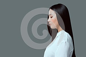 profile portrait of beautiful young asian woman standing