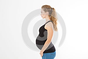 Profile portrait of blonde caucasian woman with pregnant belly isolated on white background . Pregnancy concept. Copy space