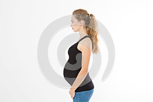 Profile portrait of blonde caucasian woman with pregnant belly isolated on white background . Pregnancy concept. Copy space