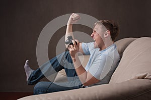 Profile portrait of an excited gamer