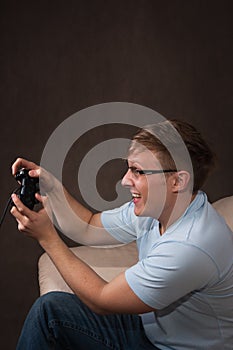 Profile portrait of an excited gamer