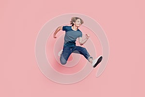 Profile portrait of handsome energetic athlete guy jump hurry shopping season concept on pink background