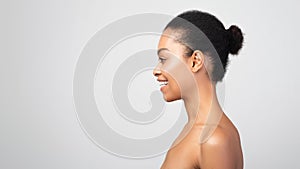 Profile Portrait Of Happy Black Woman Looking Aside, Gray Background