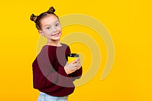 Profile portrait of lovely positive girl toothy smile arms hold cacao cup empty space  on yellow color