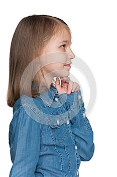 Profile portrait of a pensive little girl