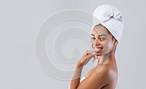 Profile portrait of pretty lady wrapped in towel