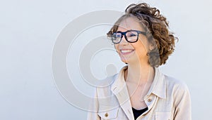 Profile portrait, smiling brunette young woman.