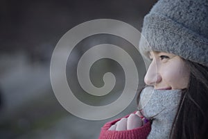 Profile portrait of smiling Caucasian brunette woman. Side view of cheerful young girl looking away.