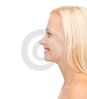 Profile portrait of smiling young woman