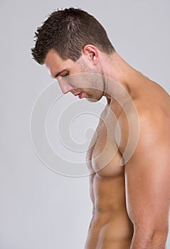 Profile portrait of strong muscular man