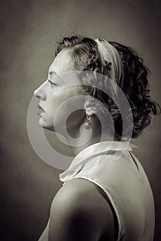 Profile portrait of a young woman in retro style