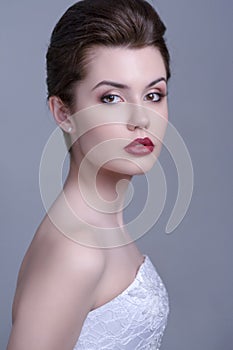 Profile of prety bride looking at camera